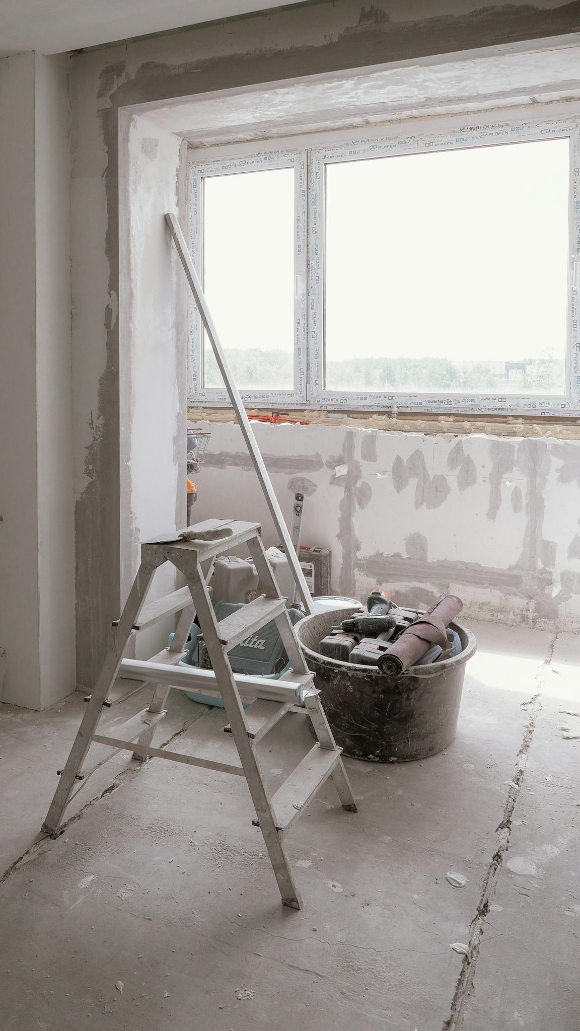 Sunlit Room Under Renovation With Tools And